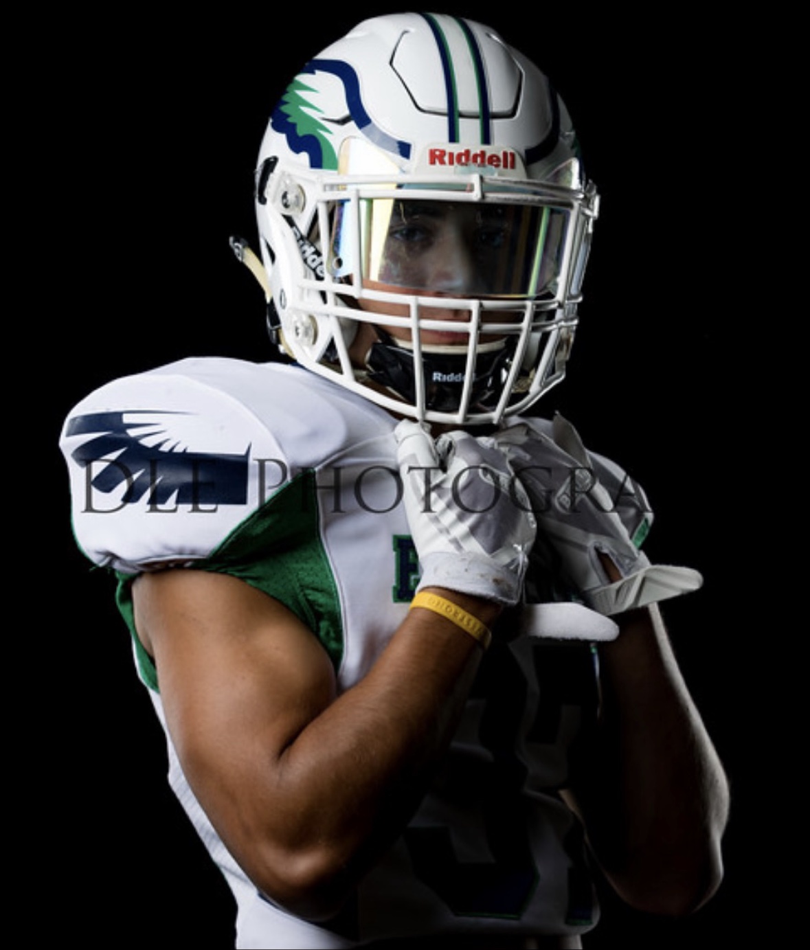 Studio portrait of Matthew in his Endicott uniform and helmet