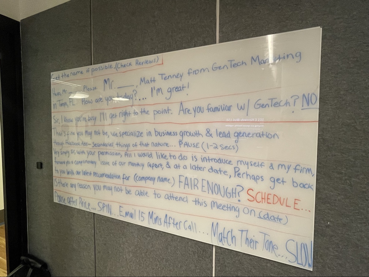 A whiteboard covered in Matthew's handwritten sales script for GenTech Marketing in Tampa